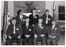 A group of seven men at an American Legion event